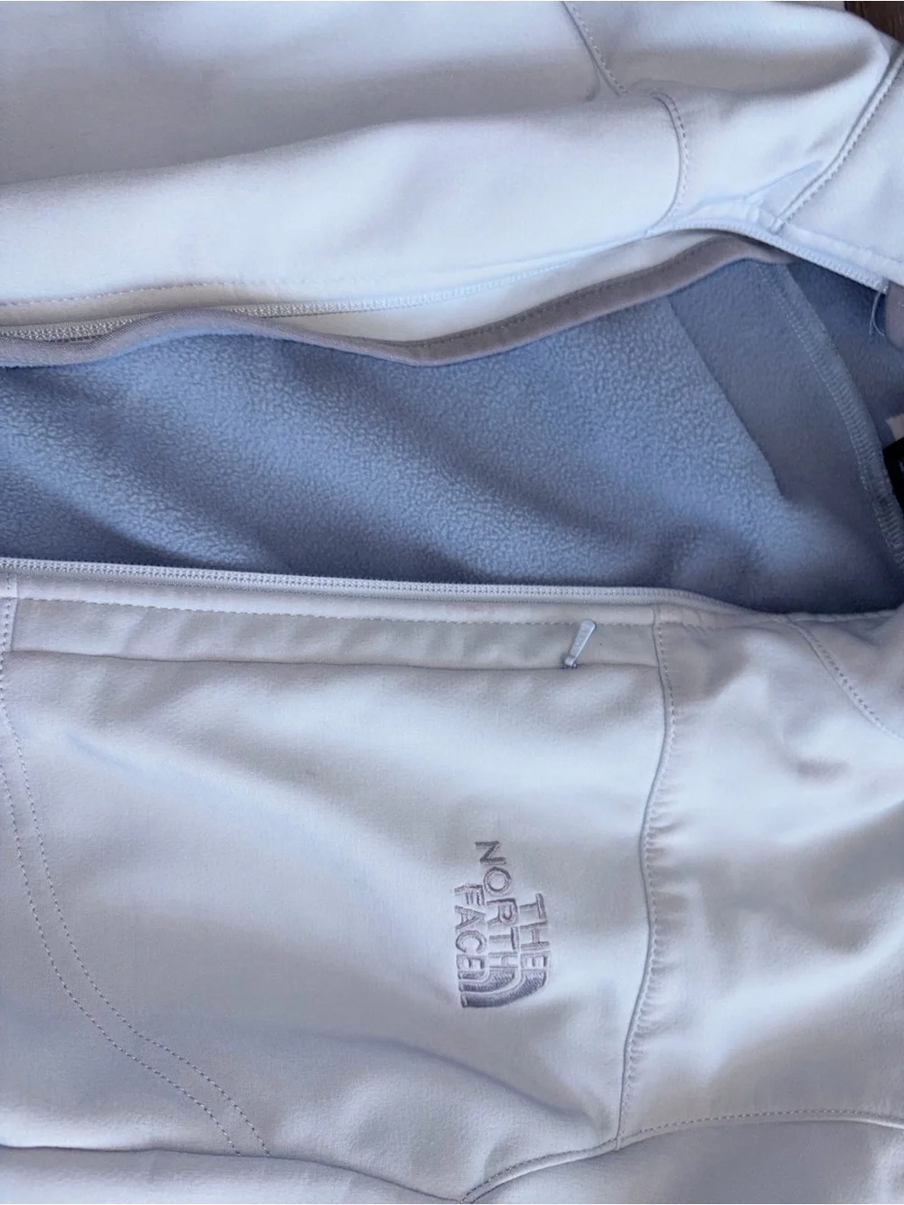 The North Face Women's White Softshell Jacket with Light Gray Fleece Lining